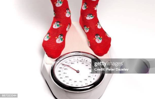 overweight post christmas weigh in - body conscious man stock pictures, royalty-free photos & images