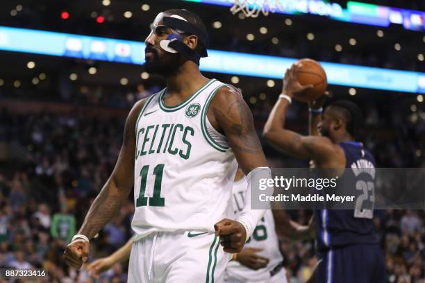 Kyrie Irving of the Boston Celtics celebrates during the second half against the Dallas Mavericks at TD Garden on December 6, 2017 in Boston,...