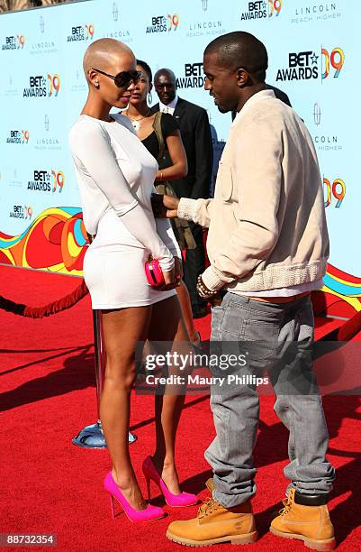 Model Amber Rose and musician Kanye West arrive at the 2009 BET Awards at the Shrine Auditorium on June 28, 2009 in Los Angeles, California.