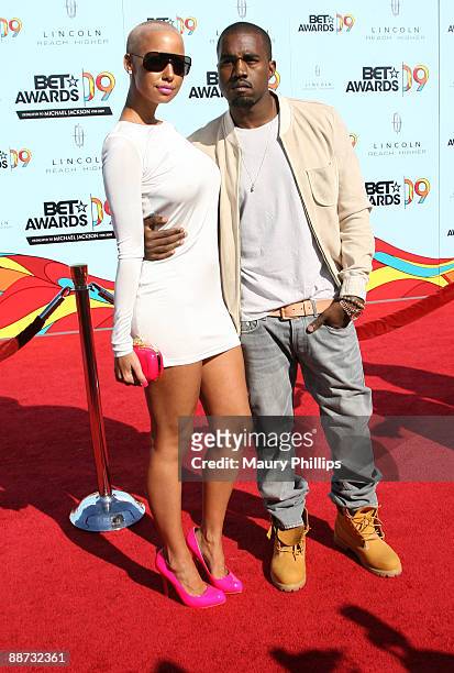 Model Amber Rose and musician Kanye West arrive at the 2009 BET Awards at the Shrine Auditorium on June 28, 2009 in Los Angeles, California.