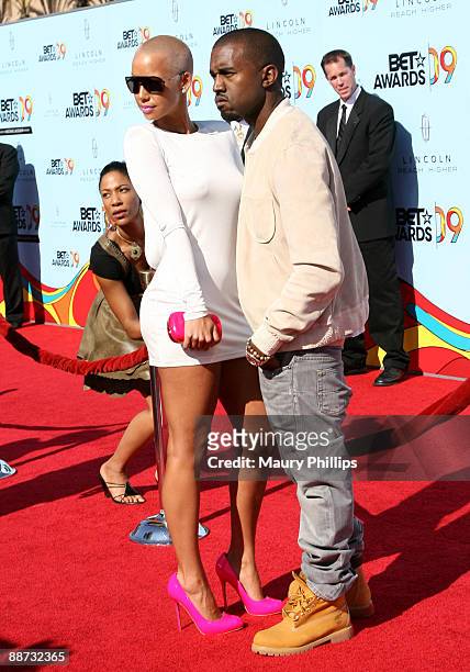 Model Amber Rose and musician Kanye West arrive at the 2009 BET Awards at the Shrine Auditorium on June 28, 2009 in Los Angeles, California.