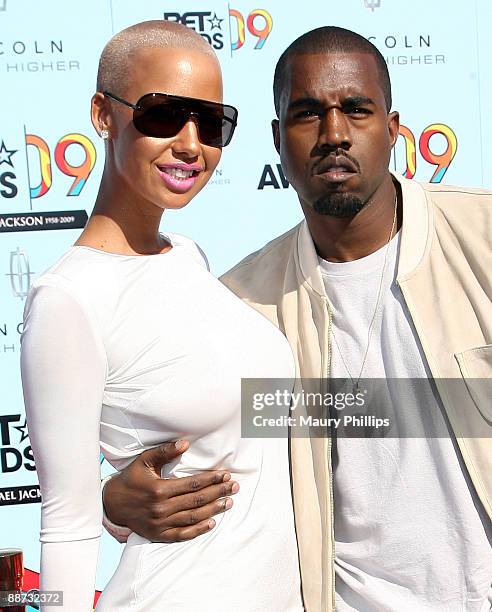 Amber Rose and rapper Kanye West arrive at the 2009 BET Awards at the Shrine Auditorium on June 28, 2009 in Los Angeles, California.