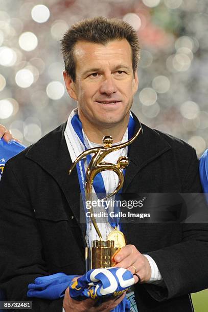 Brazil coach Dunga holds a trophy during the 2009 Confederations Cup final match between Brazil and USA from Ellis Park on June 28, 2009 in...