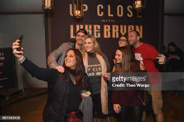 Guests pose at Pandora Up Close With Luke Bryan on December 6, 2017 in New York City.