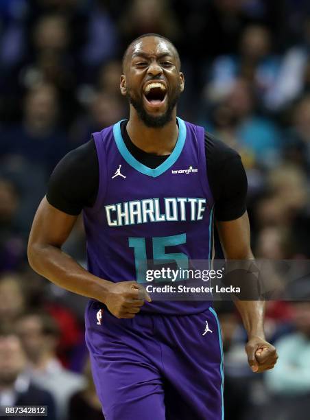 Kemba Walker of the Charlotte Hornets reacts after a play against the Golden State Warriors during their game at Spectrum Center on December 6, 2017...
