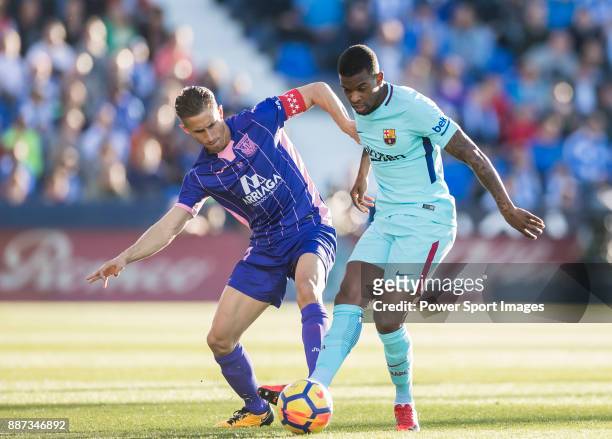 Nelson Cabral Semedo of FC Barcelona fights for the ball with Alexander Szymanowski of CD Leganes during the La Liga 2017-18 match between CD Leganes...