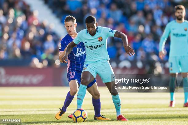 Nelson Cabral Semedo of FC Barcelona fights for the ball with Alexander Szymanowski of CD Leganes during the La Liga 2017-18 match between CD Leganes...