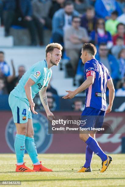 Ivan Rakitic of FC Barcelona confronts with Alexander Szymanowski of CD Leganes during the La Liga 2017-18 match between CD Leganes vs FC Barcelona...