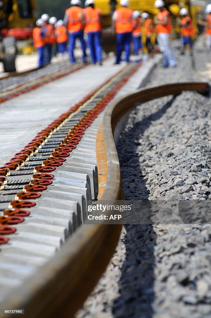 First Track Railroad Workers install the first track of the new French high speed train ...