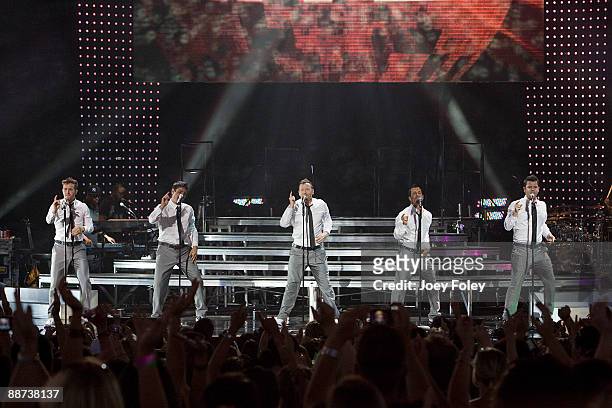 Joey McIntyre, Jonathan Knight, Donnie Wahlberg, Danny Wood, and Jordan Knight of New Kids On The Block perform in concert at the Verizon Wireless...