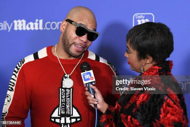 Flo Rida and Alicia Quarles attend DailyMail.com & DailyMailTV Holiday Party with Flo Rida on December 6, 2017 at The Magic Hour in New York City.