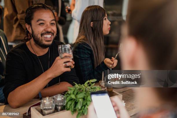 friends socialising in bar - melbourne food imagens e fotografias de stock