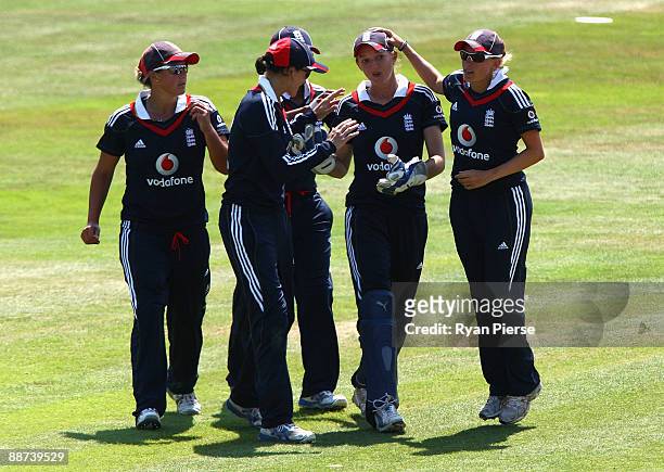Sarah Taylor of England is congratulated by teammates after catching Sarah Andrews of Australia during the Women's One Day International match...