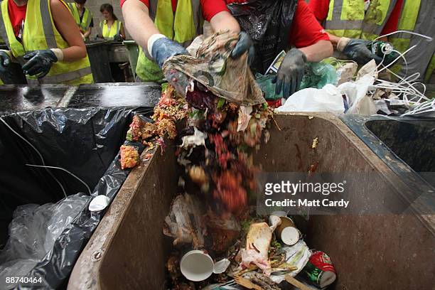 Volunteer workers sort food waste and rubbish for recycling at the Glastonbury Festival recycling centre on June 29, 2009 in Glastonbury, England....