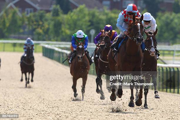 Red Cadeaux ridden by Seb Sanders romps home to win the Bet Wimbledon Tennis-Betdaq Stakes race at Dunstall Park on on June 29, 2009 in...