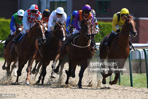 Red Cadeaux riden by Seb Sanders on their way to winning the Bet Wimbledon Tennis-Betdaq Stakes race at Dunstall Park on on June 29, 2009 in...