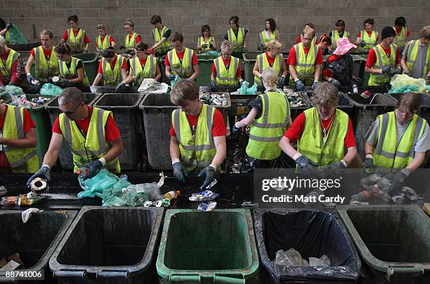 Volunteer workers sort rubbish for recycling at the Glastonbury Festival recycling centre on June 29, 2009 in Glastonbury, England. Every year the...