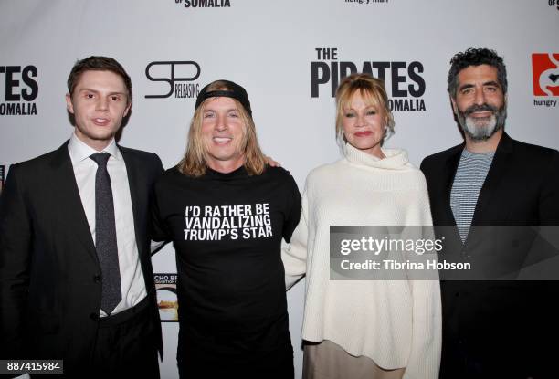 Evan Peters, Bryan Buckley, Melanie Griffith and Mino Jarjoura attend the premiere of 'The Pirates Of Somalia' at TCL Chinese 6 Theatres on December...