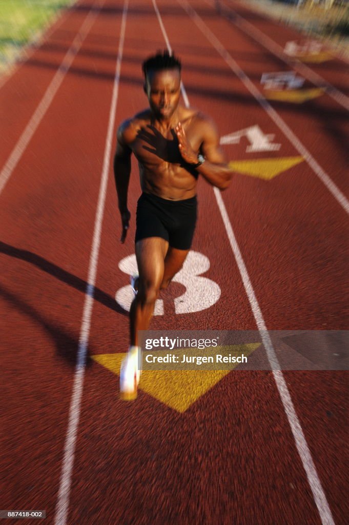 Runner on track (blurred motion)