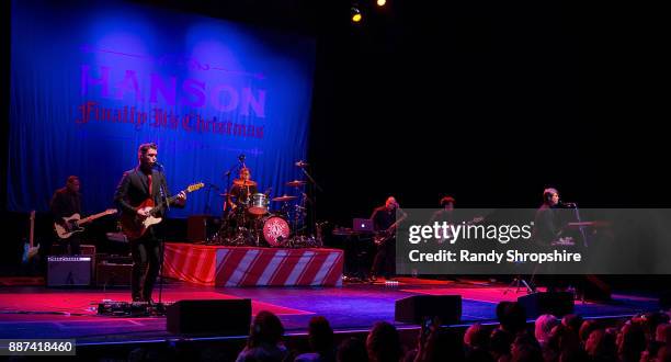 Isaac Hanson, Zac Hanson and Taylor Hanson of the band Hanson performs on stage at The Wiltern on December 6, 2017 in Los Angeles, California.