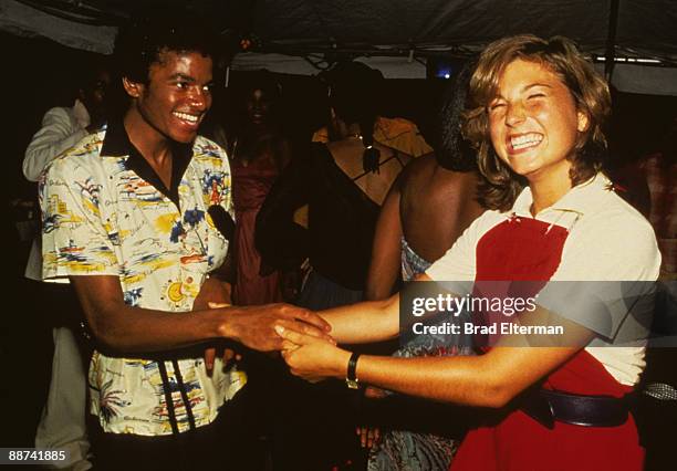 Michael Jackson and Tatum O' Neal dance at a party held inside a bank in celebration of The Jackson's gold records in Los Angeles, California....