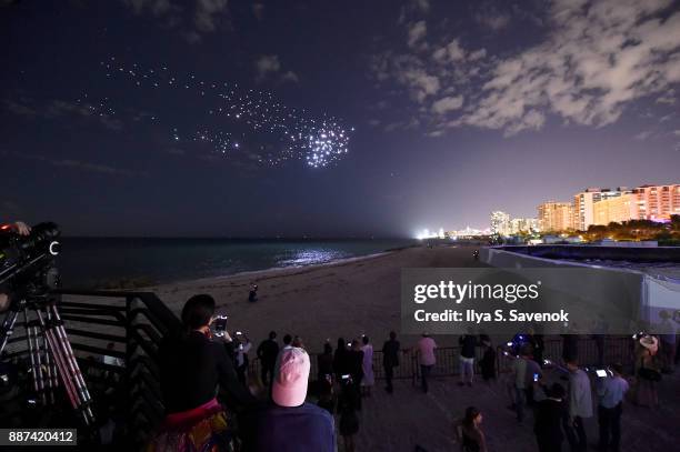 Guests watch the World Premiere Of FRANCHISE FREEDOM - A Flying Sculpture By Studio Drift In Partnership With BMW at The Faena Art Dome on December...