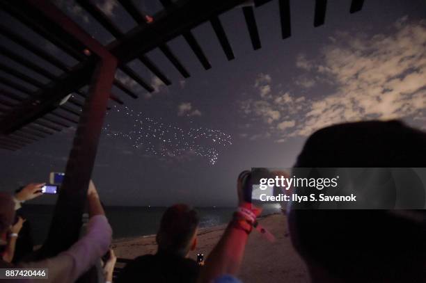 Guests watch the World Premiere Of FRANCHISE FREEDOM - A Flying Sculpture By Studio Drift In Partnership With BMW at The Faena Art Dome on December...