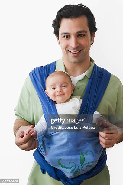 father and baby son - baby carrier stock pictures, royalty-free photos & images