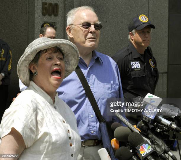 Victim Judith Welling and DeWitt Clinton Baker smile as they leave the United States Courthouse in New York June 29, 2009 after Bernard Madoff...