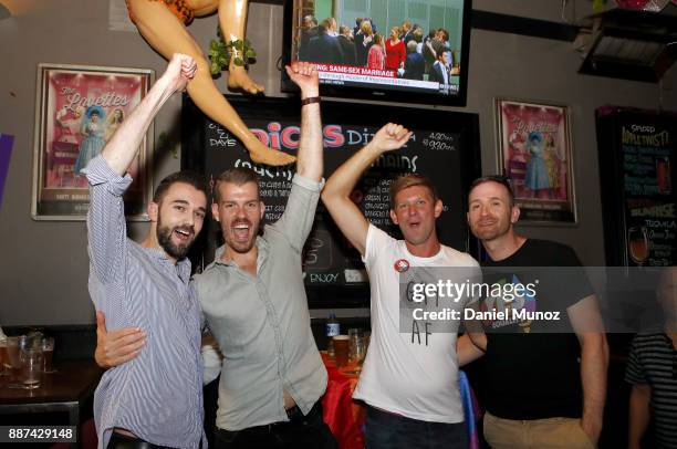 People celebrate after the passing of the gay marriage bill on December 7, 2017 in Sydney, Australia. The historic bill was passed on the final day...