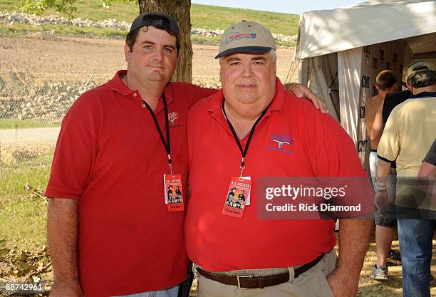 Chris Rouse and his dad GM Stampede Wayne Rouse backstage during Country Stampede 2009 at Tuttle Creek State Park on June 28, 2009 in Manhattan,...