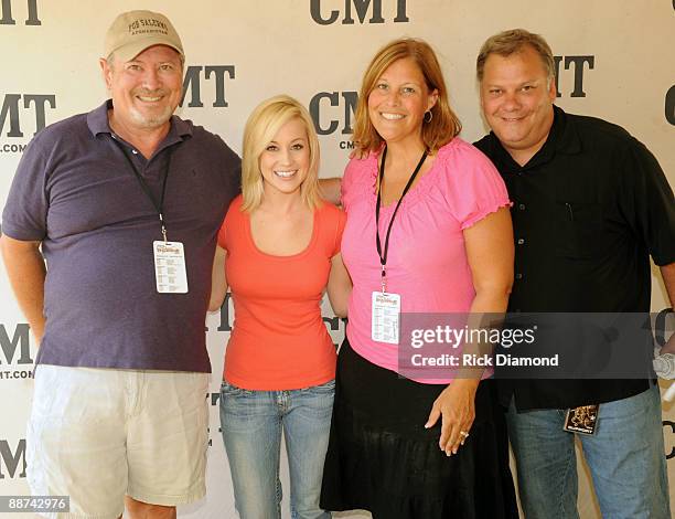 Agent/Promoter Gil Cunningham, Singer/Songwriter Kellie Pickler, Promoter Liz Cunningham and Pickler Tour Manager Danny Perdieu backstage during...