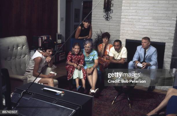 During NASA's Apollo 11 mission to the moon, astronaut families watch television coverage, July 20, 1969. Pictured are Pat Collins and her daughter...