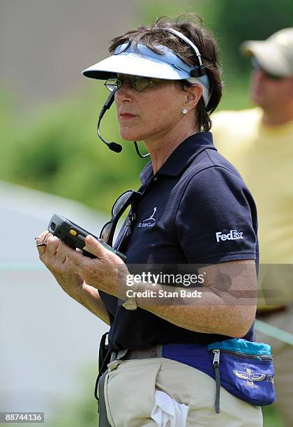 Volunteer records data for ShotLink scoring during the third round of the St. Jude Classic at TPC Southwind on June 13, 2009 in Memphis, Tennessee.