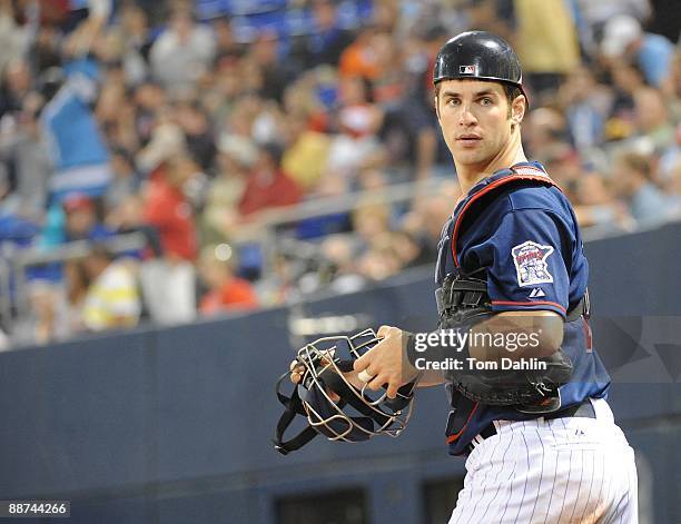 Joe Mauer of the Minnesota Twins runs onto the field at an MLB game against the Pittsburgh Pirates at the Hubert H. Humphrey Metrodome, June 16, 2009...