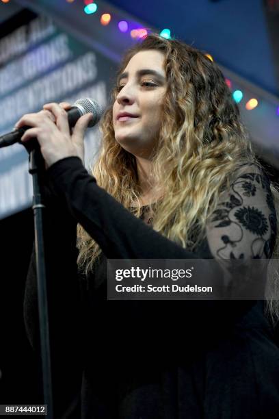 Singer Ambha Love performs as a special guest during Mike Love's performance at Amoeba Music on December 6, 2017 in Hollywood, California.