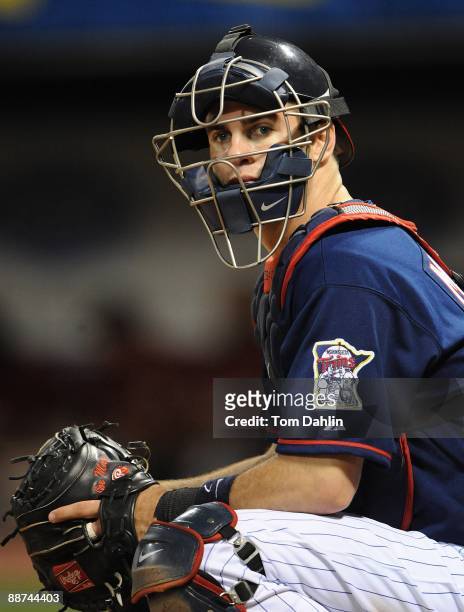 Joe Mauer of the Minnesota Twins looks for a signal at an MLB game against the Houston Astros at the Hubert H. Humphrey Metrodome, June 19, 2009 in...