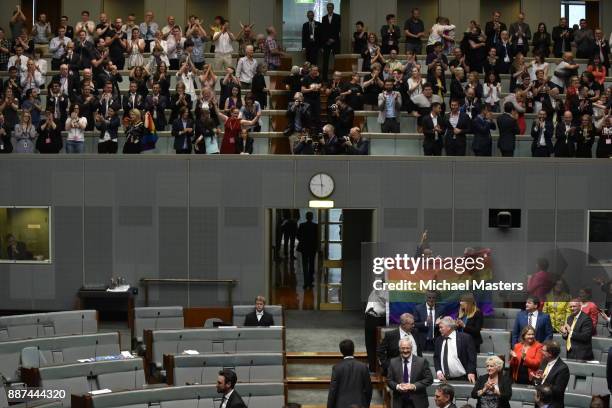 Members of Parliament celebrate at Parliament House on December 7, 2017 in Canberra, Australia. The historic bill was passed on the voices and no...