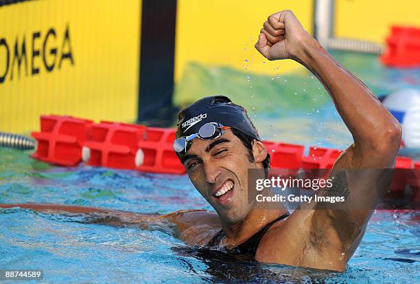 Italian swimmer Filippo Magnini celebrates victory during the Men's 4x200m final at the XVI Mediterranean Games on June 29, 2009 in Pescara, Italy.