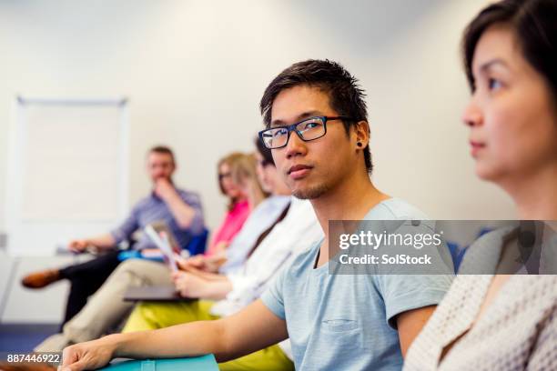 male attending in a business presentation - england training session stock pictures, royalty-free photos & images