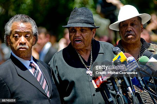 Joe Jackson , father of Michael Jackson, speaks as Reverend Al Sharpton and Marshall Thompson listen during a press conference outside the Jackson...