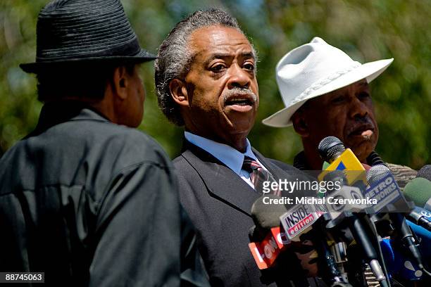 Reverend Al Sharpton speaks as Joe Jackson, father of Michael Jackson and Marshall Thompson listen during a press conference outside the Jackson...