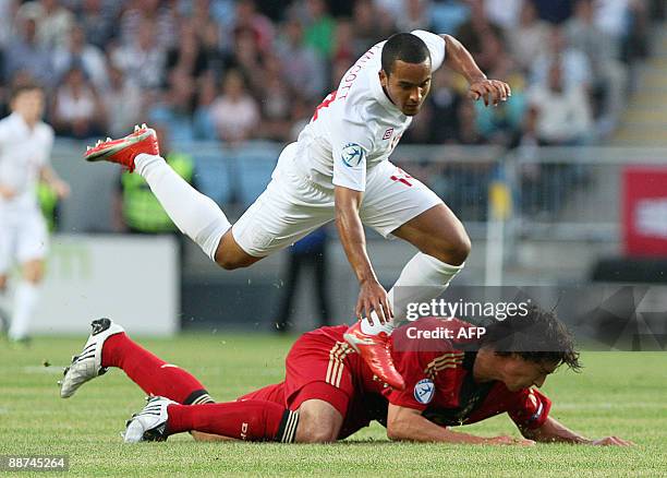 England's Theo Walcott stumbles over Germeny's Mats Hummles in the U21 European Championship final soccer match Germany vs. England at the Malmo New...