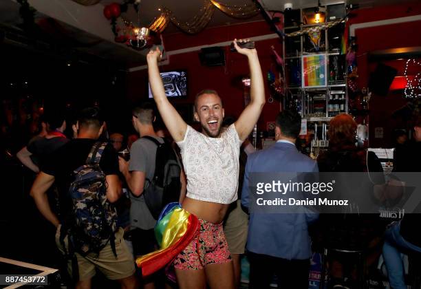 Man celebrates after the passing of the gay marriage bill on December 7, 2017 in Sydney, Australia. The historic bill was passed on the final day of...