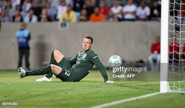 England's goalkeeper Scott Loach fails to get control of the 2-0 shot from Mesut zil in the U21 European Championship final football match Germany...