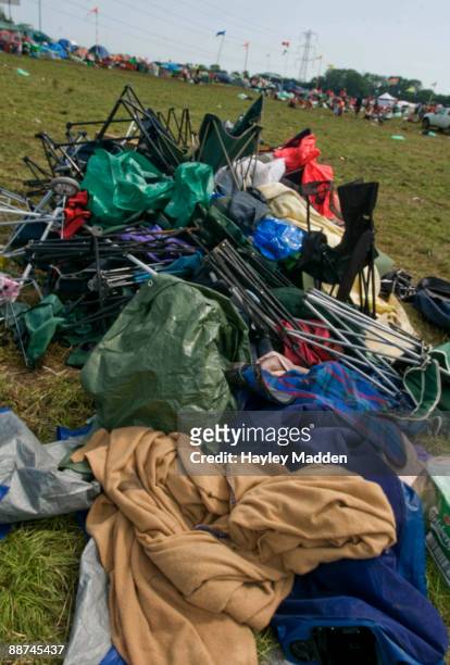 Abandoned chairs and blankets piled up as the clear up of the Glastonbury Festival begins following the last day at Worthy Farm on June 29, 2009 in...