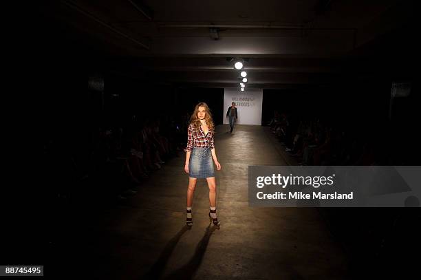 Model walks the runway at the Autumn Winter collection of 'William Rast' at Selfridges on June 29, 2009 in London, England.