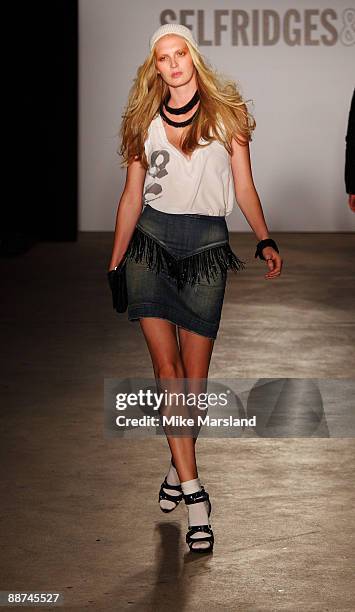 Model walks the runway at the Autumn Winter collection of 'William Rast' at Selfridges on June 29, 2009 in London, England.