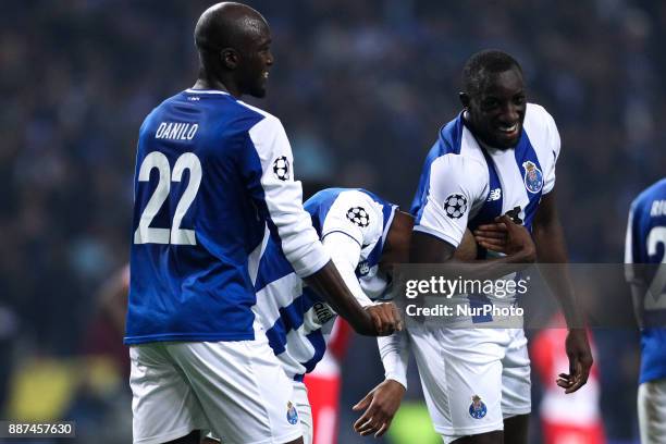 Porto's Algerian forward Yacine Brahimi celebrates after scoring a goal with Porto's Malian forward Moussa Marega and Porto's Portuguese midfielder...