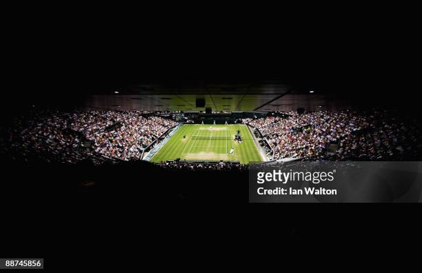 View under the closed roof on Centre Court as Andy Murray of Great Britain plays Stanislas Wawrinka of Switzerland during the men's singles fourth...